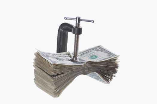 US dollar bills in a vice