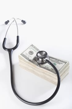 Close_up of a stethoscope on paper currency