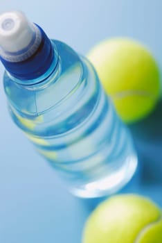 High angle view of a water bottle with two tennis balls