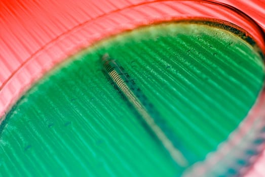 Close_up of a syringe with a petri dish