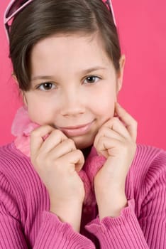Close_up of a girl holding her sweater and smiling