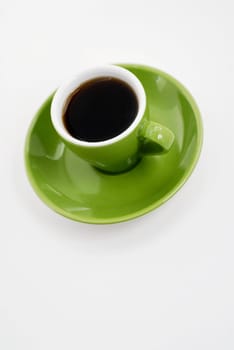 High angle view of a cup of black tea on a saucer
