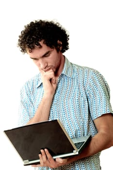 Close-up of a young man holding a laptop