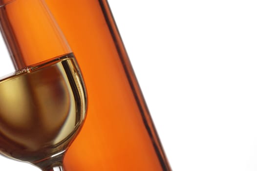 Close-up of a glass of wine with a wine bottle
