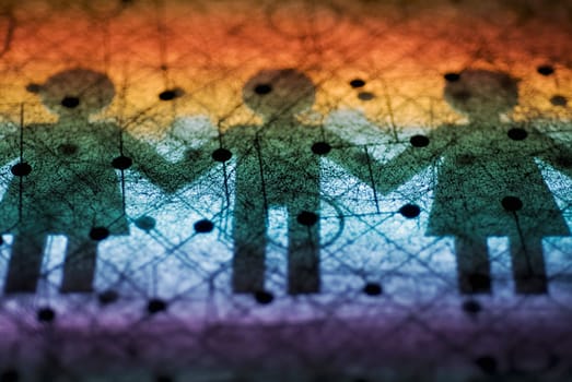 Close_up of a circuit board with paper chain dolls shadow on it