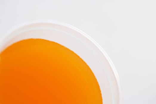 High angle view of a glass of orange juice