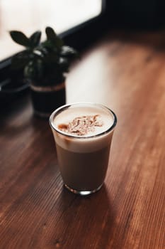 Cup of coffee at table in cafe near window. Blurred background. High quality photo
