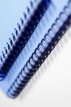Close-up of two spiral notebooks