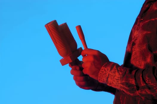 Mid section view of a musician playing the maracas