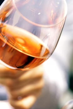 Close-up of a personŽs hand holding a glass of wine