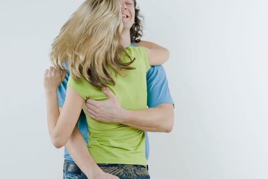 Close_up of a young couple embracing each other