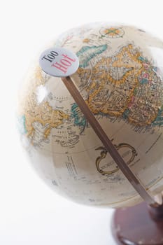 Too hot badge on a globe