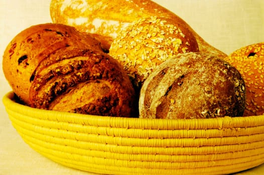 Close-up of brown bread and buns in a basket