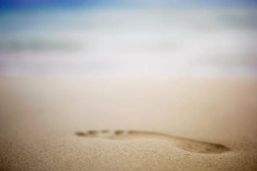 Close-up of a footprint in the sand