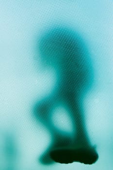 Low angle view of a person on a glass floor