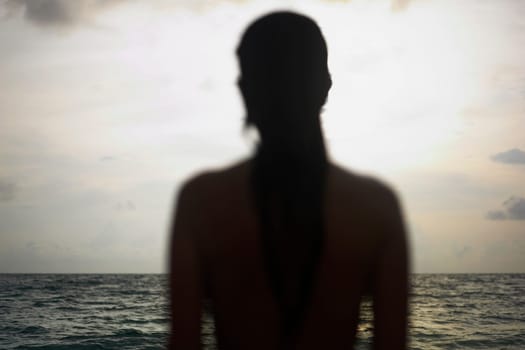 Silhouette of a young woman