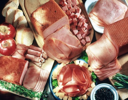High angle view of assorted ham products