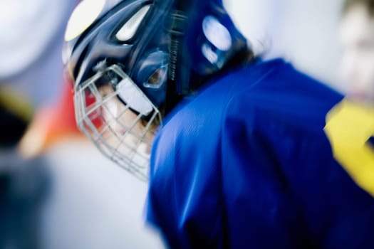 Side profile of an ice hockey player wearing a helmet