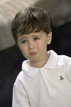 Close-up of a boy looking sad