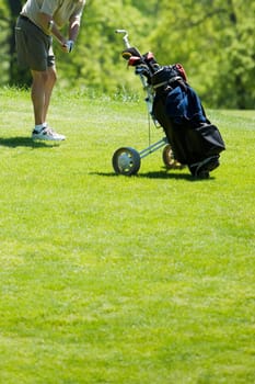Side profile of a man swinging a golf club