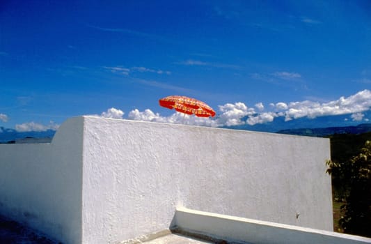 Low angle view of a patio umbrella on a terrace
