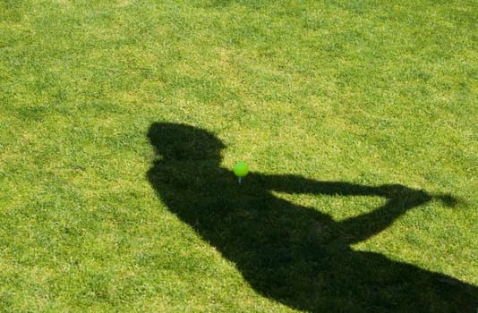 Shadow of a person on the grass