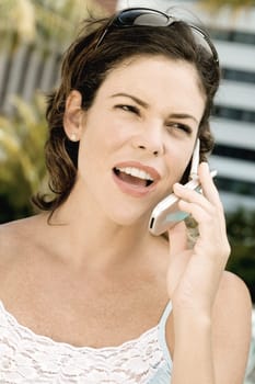 Close-up of a young woman talking on a mobile phone