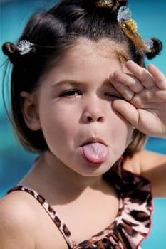 Portrait of a girl sticking her tongue out