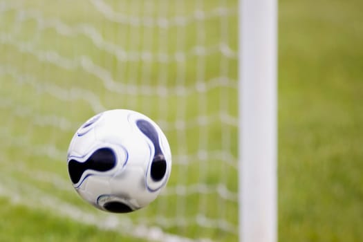 Close-up of a soccer ball in mid-air