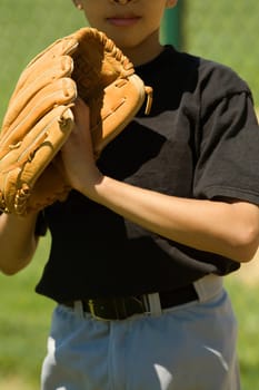 Close-up of a baseball player standing in a baseball field