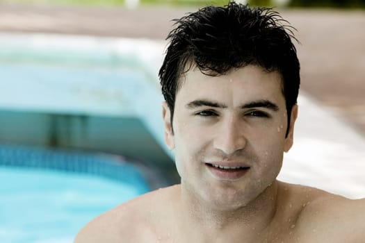 Portrait of a young man in a swimming pool