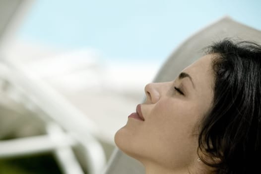 Close-up of a young woman with closed her eyes