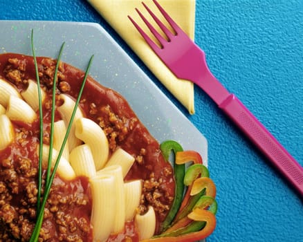 Close-up of Bolognese sauce in a plate of macaroni