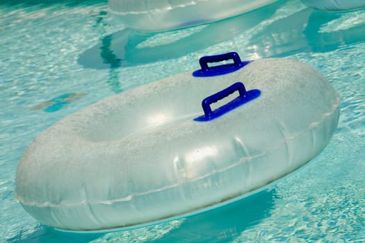 Inflatable rings floating in a pool