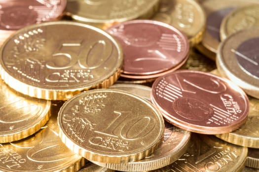 Close-up pile of Euro coins. Financial concept.