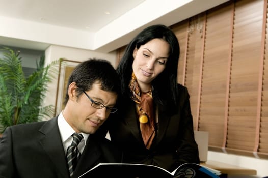 Close-up of a businessman and a businesswoman in an office