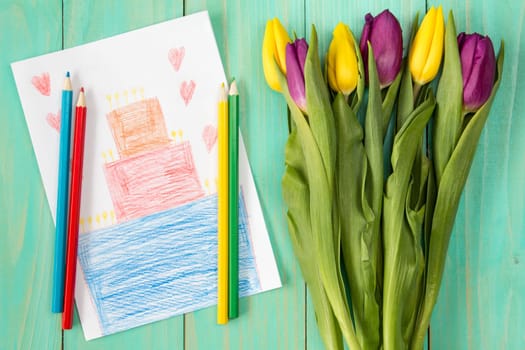 Handmade birthday greeting card and bouquet of tulips