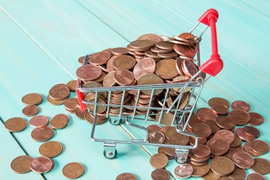 Shopping cart full of Euro cent coins