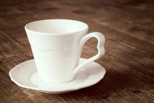 Close up view of an empty espresso cup with a saucer.