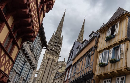 Street in Quimper with a view of the Cathedral of Saint Corentin, Brittany, France