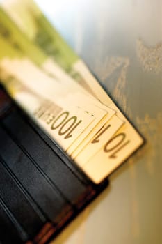 Close-up of one hundred Euro banknotes in a wallet