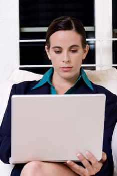 Close-up of a businesswoman using a laptop