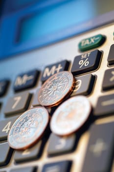 Close-up of Eurocent coins on a calculator