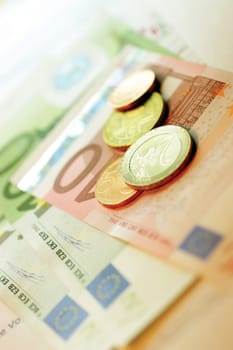 Close-up of Eurocent coins on Euro banknotes