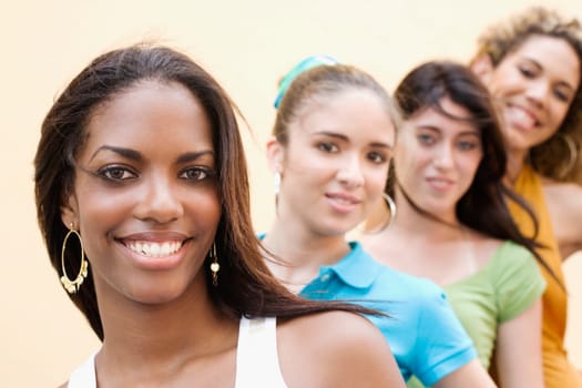Portrait of four teenage girls smiling