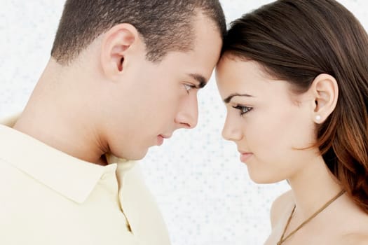 Side profile of a young couple face to face