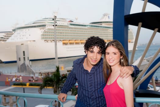 Portrait of a young man standing with a teenage girl