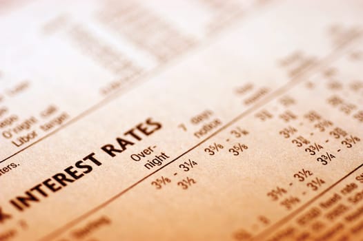 Paper with interest rates, close-up