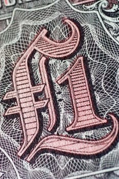 Number and symbol on bank note, extreme close-up