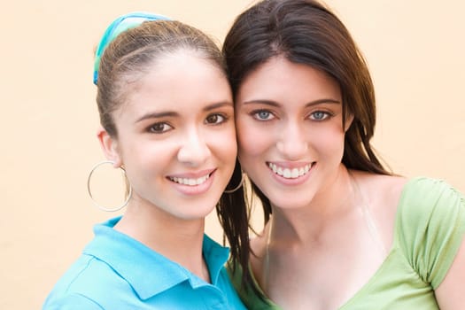 Portrait of two teenage girls smiling
